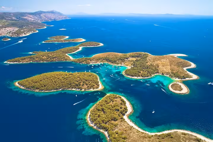 Panoramic aerial of Paklinski Islands by Hvar with secluded coves and sailing boats on a private island-hopping tour