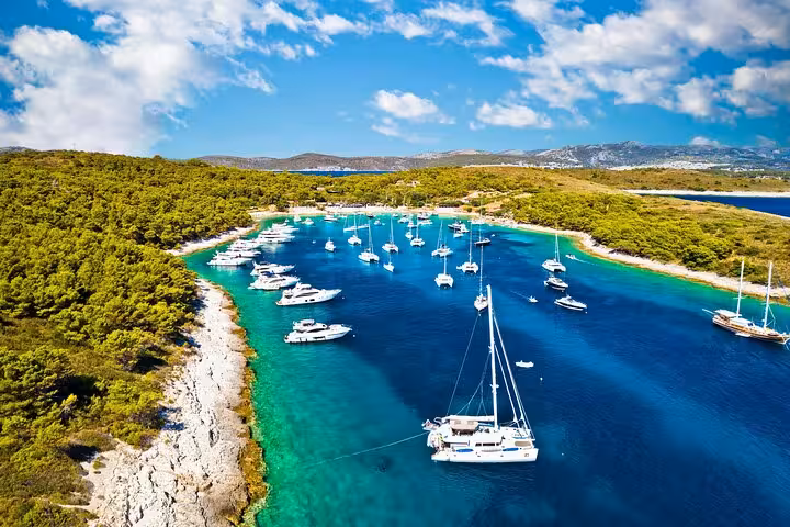 Aerial view of Paklinski Islands bay near Hvar with yachts anchored in turquoise water on private boat tour