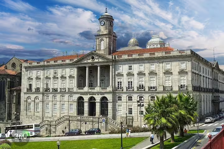 Neoclassical facade of Palácio da Bolsa in Porto, Portugal, under a vibrant sky; highlight of private Porto-Aveiro tours.