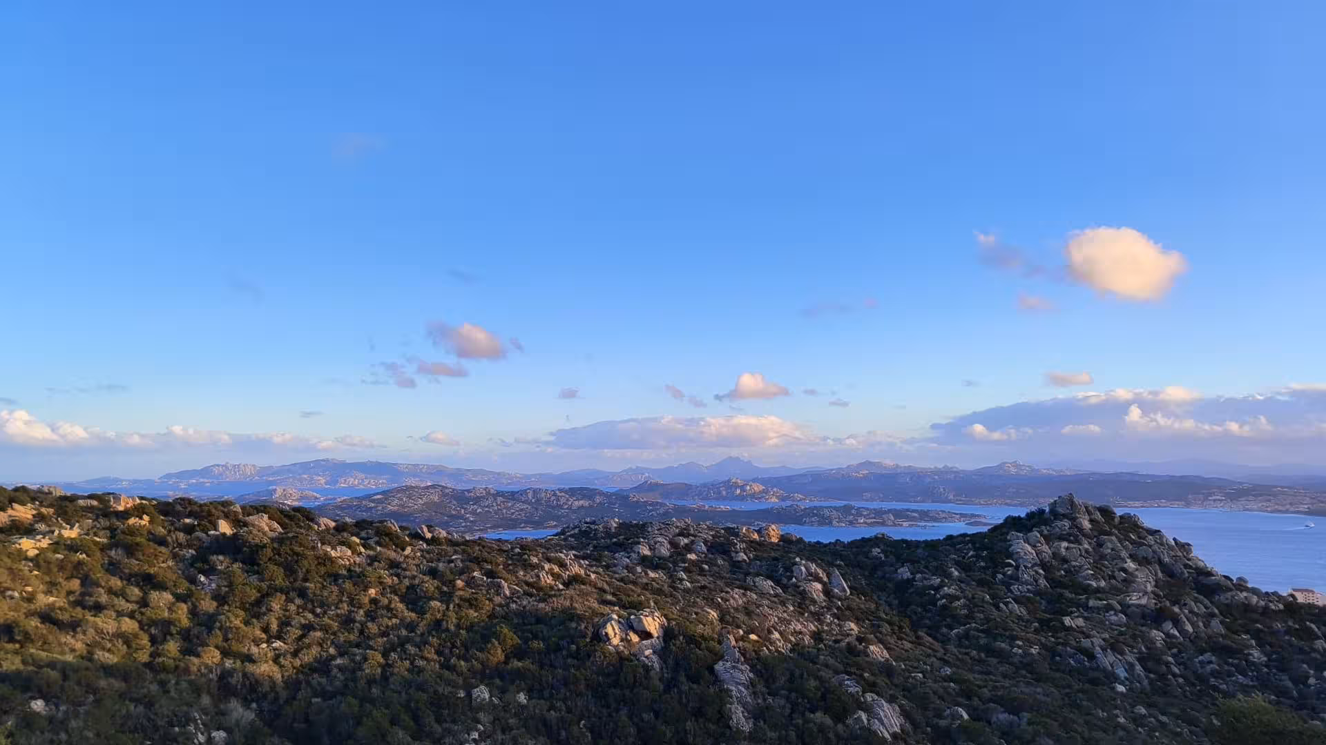 Scenic view of rolling hills and coastline on the Palau e-bike tour to Caprera and La Maddalena.
