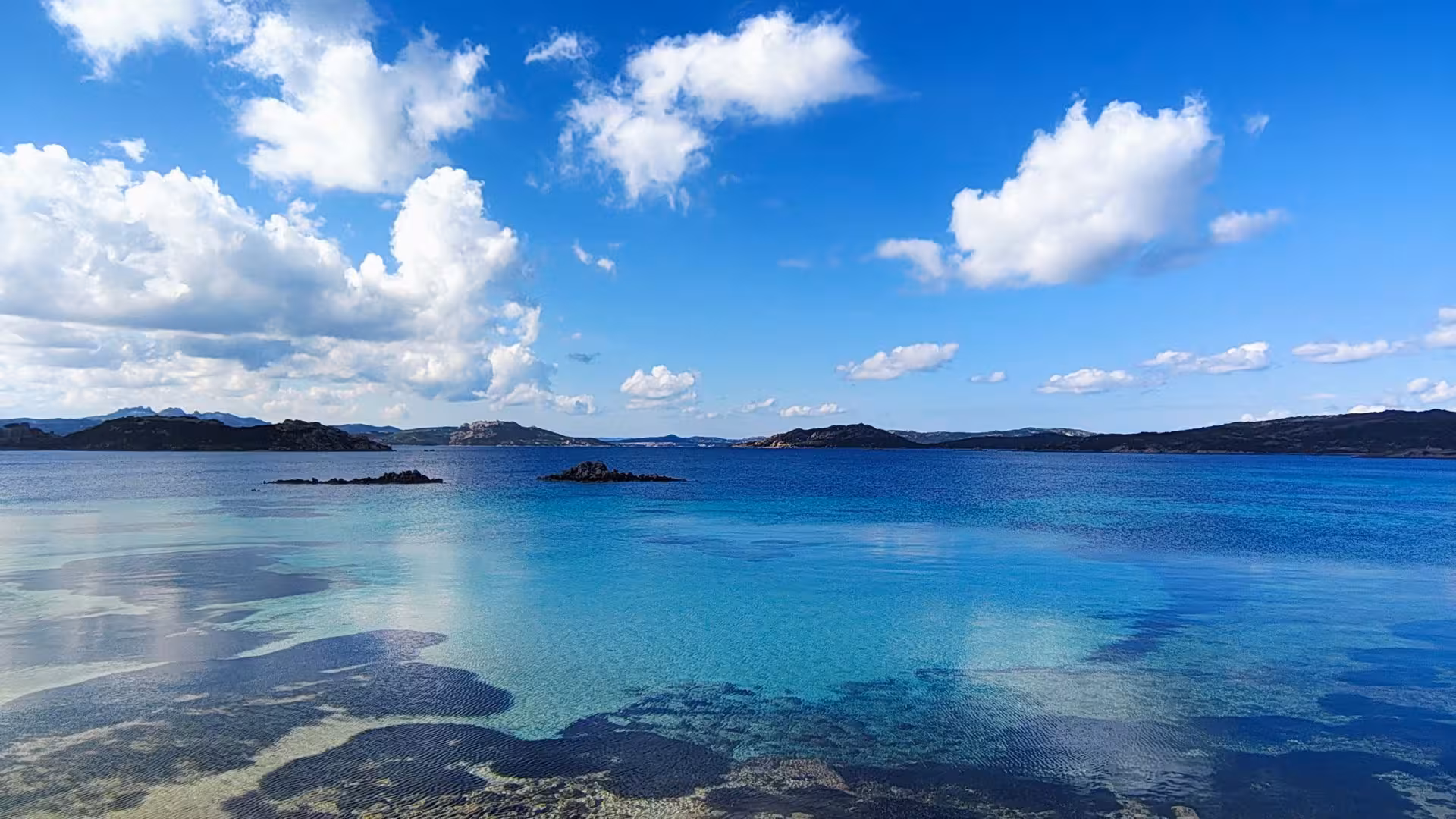 Crystal-clear waters and distant islands on the Palau e-bike tour to Caprera and La Maddalena.