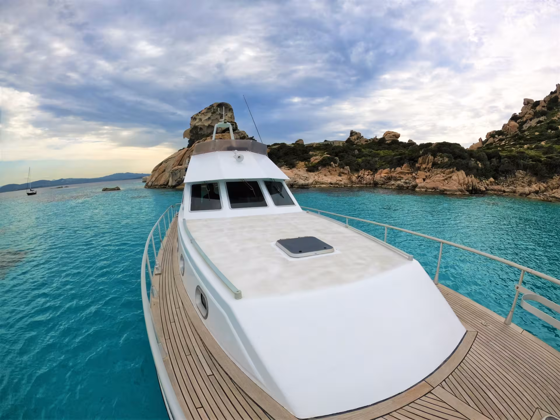 Explore the pristine turquoise waters of La Maddalena Archipelago aboard a luxury boat from Palau.