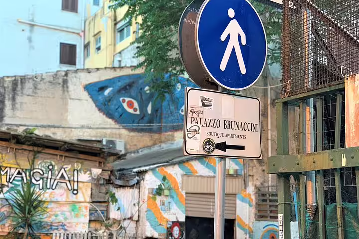 Street sign to Palazzo Brunaccini boutique apartments in Palermo’s historic center, ideal landmark for airport transfer pickup