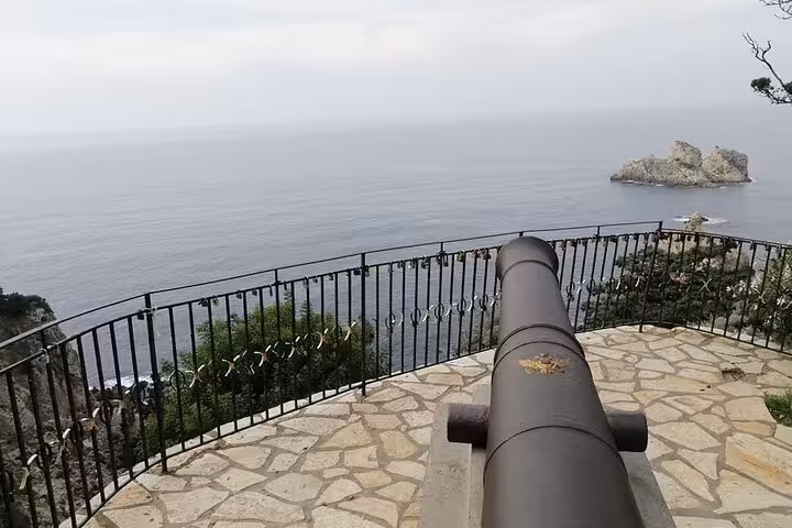 Old sea cannon viewpoint over Paleokastritsa bay, Corfu, on a private tour with local tastings