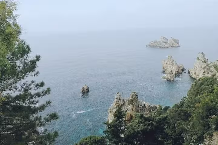 Paleokastritsa coastline in Corfu with dramatic sea stacks and turquoise water on a private tour