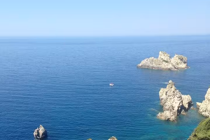 Rocky islets and deep blue Ionian Sea at Paleokastritsa, Corfu private tour with local tastings