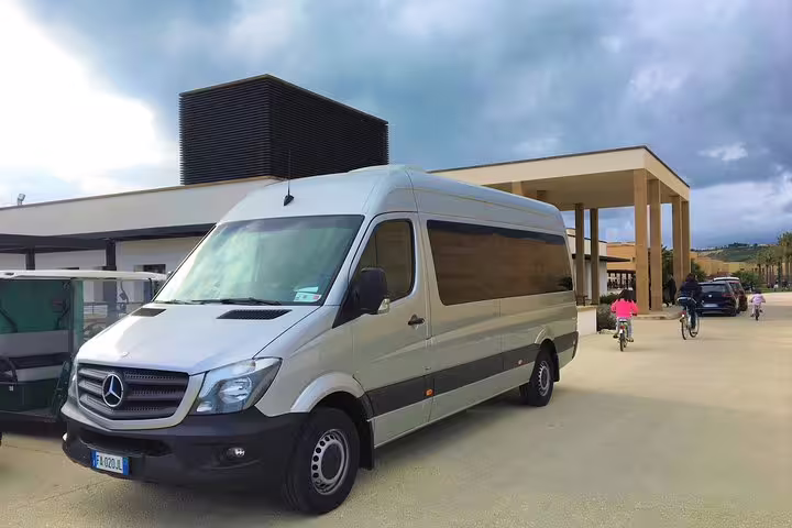 Modern Mercedes minivan used for private transfer between Palermo Airport PMO and Astoria Palace Hotel entrance