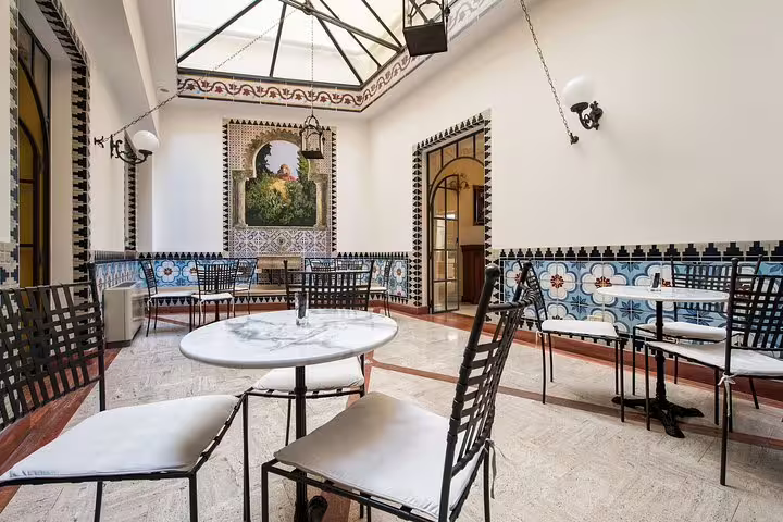 Elegant tiled courtyard lounge at Best Western Ai Cavalieri Hotel Palermo, ideal arrival setting after airport transfer