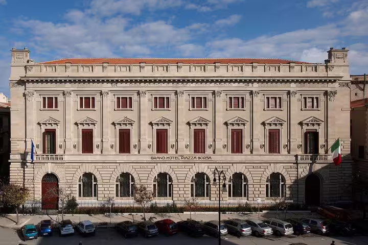 Street view of Grand Hotel Piazza Borsa Palermo, historic luxury hotel near port and city center, perfect for private airport transfers