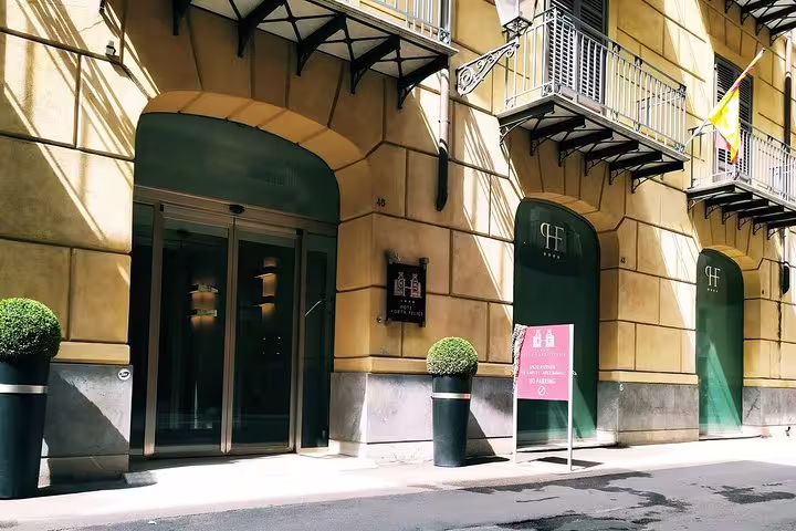 Elegant street view of Hotel Porta Felice entrance in central Palermo, ideal drop-off point for private airport transfer service