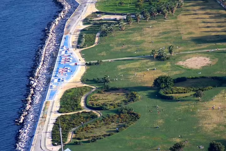 Coastal park near Palermo with walking paths and sea views, ideal scenery before private transfer to NH Palermo Hotel