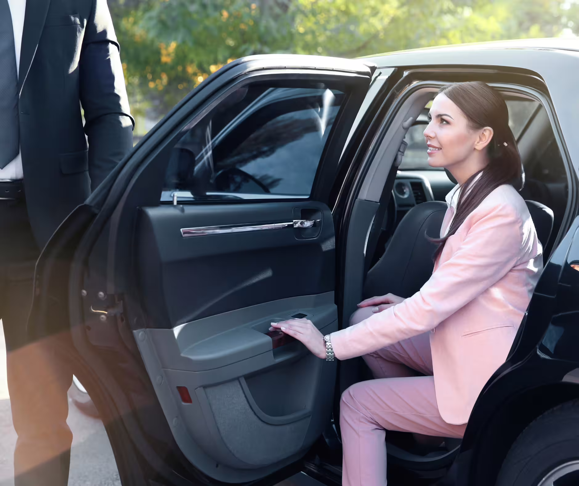 Business traveler entering a chauffeured sedan, illustrating comfortable private transfer service between Palermo airport and Trapani