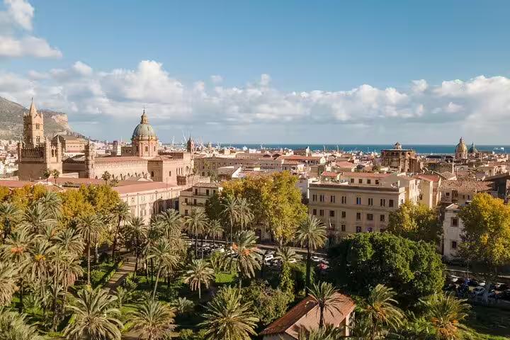Palermo skyline with cathedral domes and palm gardens, scenic stop on private Monreale and Mondello day trip