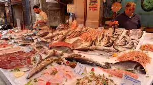 Vibrant Palermo fish market with fresh seafood on ice, local vendors and authentic Sicilian flavors on full day tour