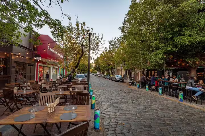 Palermo Soho cobblestone street with outdoor cafes, featured on a private half-day Buenos Aires city tour