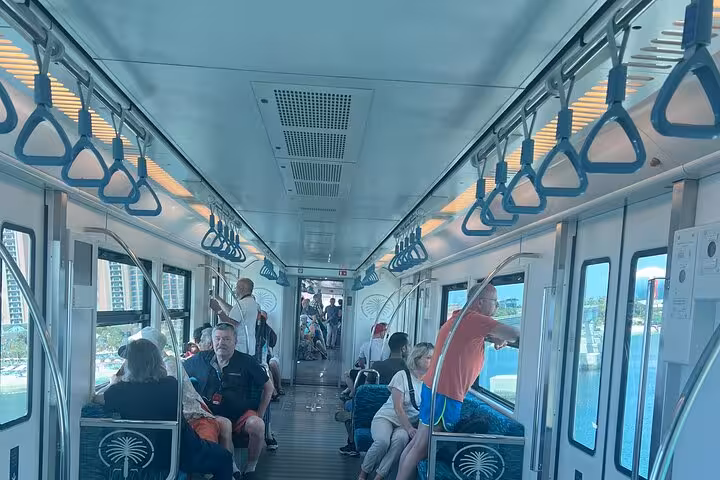 Inside Palm Monorail cabin to Palm Jumeirah, scenic ride included for The View at The Palm tour tickets