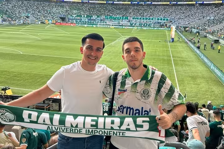 Fans hold Palmeiras scarf at Allianz Parque during São Paulo Palmeiras game experience with local guide
