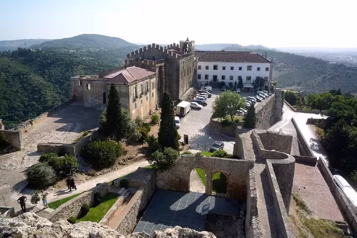 Aerial view of Palmela Castle surrounded by lush landscapes, a highlight of the Arrábida, Azeitão, Setúbal tour from Lisbon.
