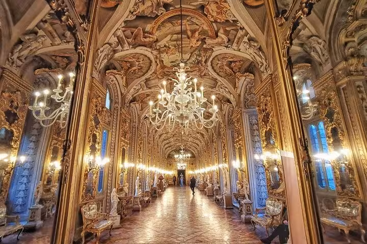 Luxurious corridor at Pamphilj Gallery featuring grand chandeliers and intricate ceiling art, perfect for skip-the-line access.
