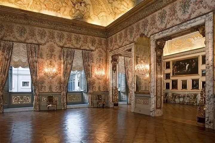 Elegant room in Pamphilj Gallery with ornate decor, chandeliers, and classic art, ideal for skip-the-line tour tickets.