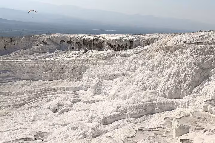Panoramic view of Pamukkale travertine terraces and limestone formations on a private full-day tour from Antalya