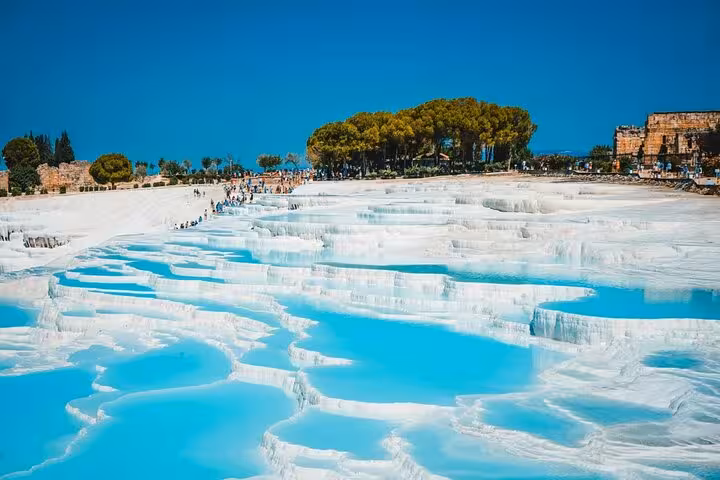 Pamukkale white travertine terraces and turquoise pools, highlight of 5-day Ephesus Pamukkale Cappadocia tour