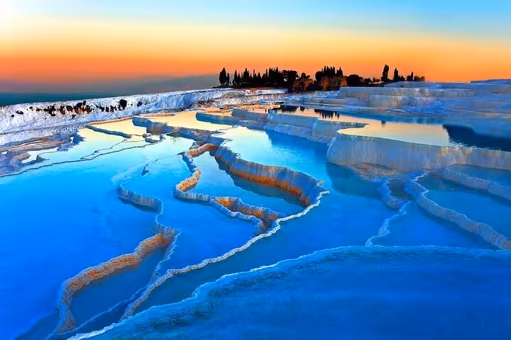 Sunset over Pamukkale travertine terraces on private full-day tour from Antalya, Turkey thermal pools