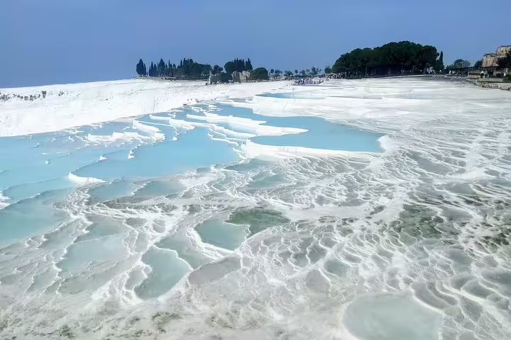 Pamukkale white travertine terraces and thermal pools in Turkey on Istanbul to Seven Churches of Asia Minor tour