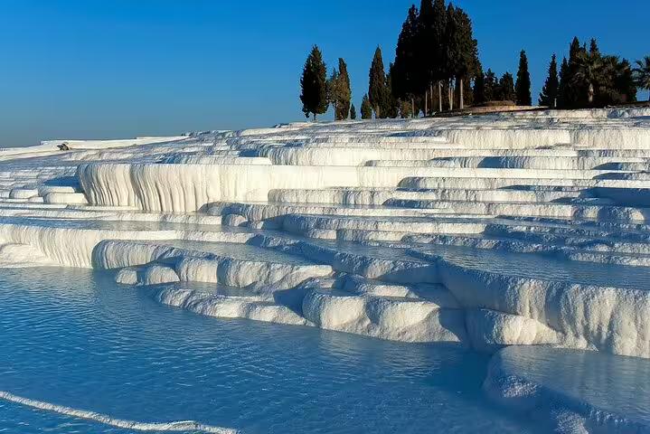 Pamukkale white travertine terraces and thermal pools in Turkey, scenic stop on 13-day guided history tour