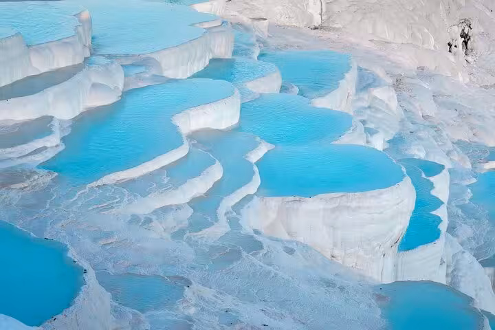 Pamukkale white travertine terraces with turquoise thermal pools, highlight of 7 day express Turkey tour