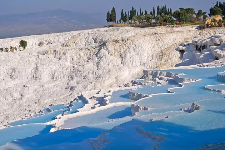 Pamukkale white travertine terraces and turquoise thermal pools on a private day tour from Kusadasi or Selcuk