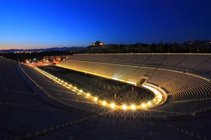 Night view of Panathenaic Stadium Athens lit up, scenic stop on Athens highlights and Cape Sounion tour