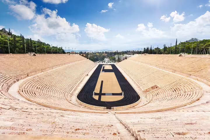 Panathenaic Stadium Athens on private full-day tour, marble stands and track under blue sky