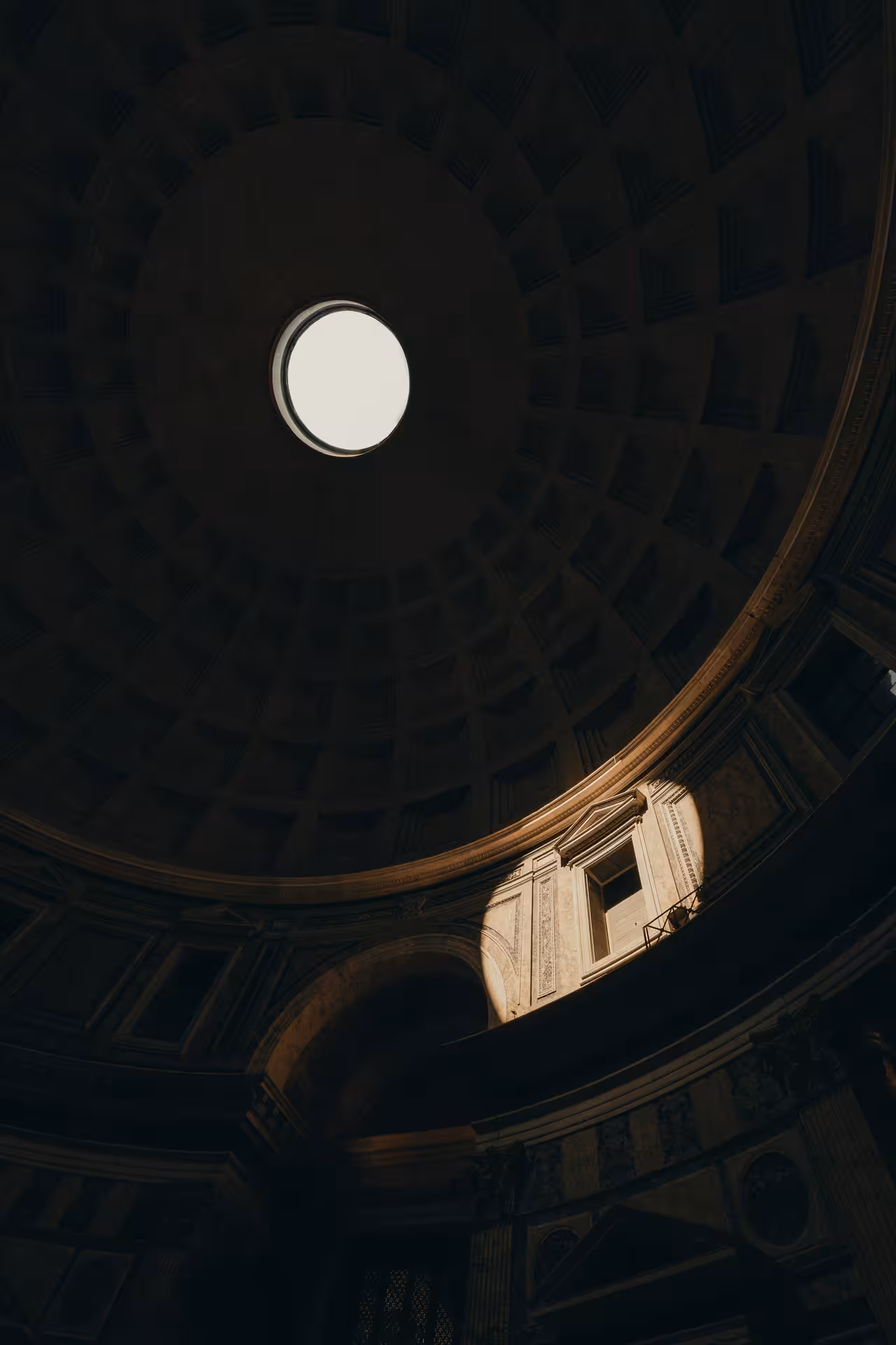 Sunlight beams through the Pantheon's oculus, illuminating the ancient Roman dome on the Pantheon Combo Tour.