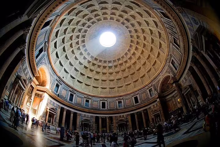 Interior of the Pantheon dome with oculus and visitors exploring on a Rome famous squares and fountains group tour