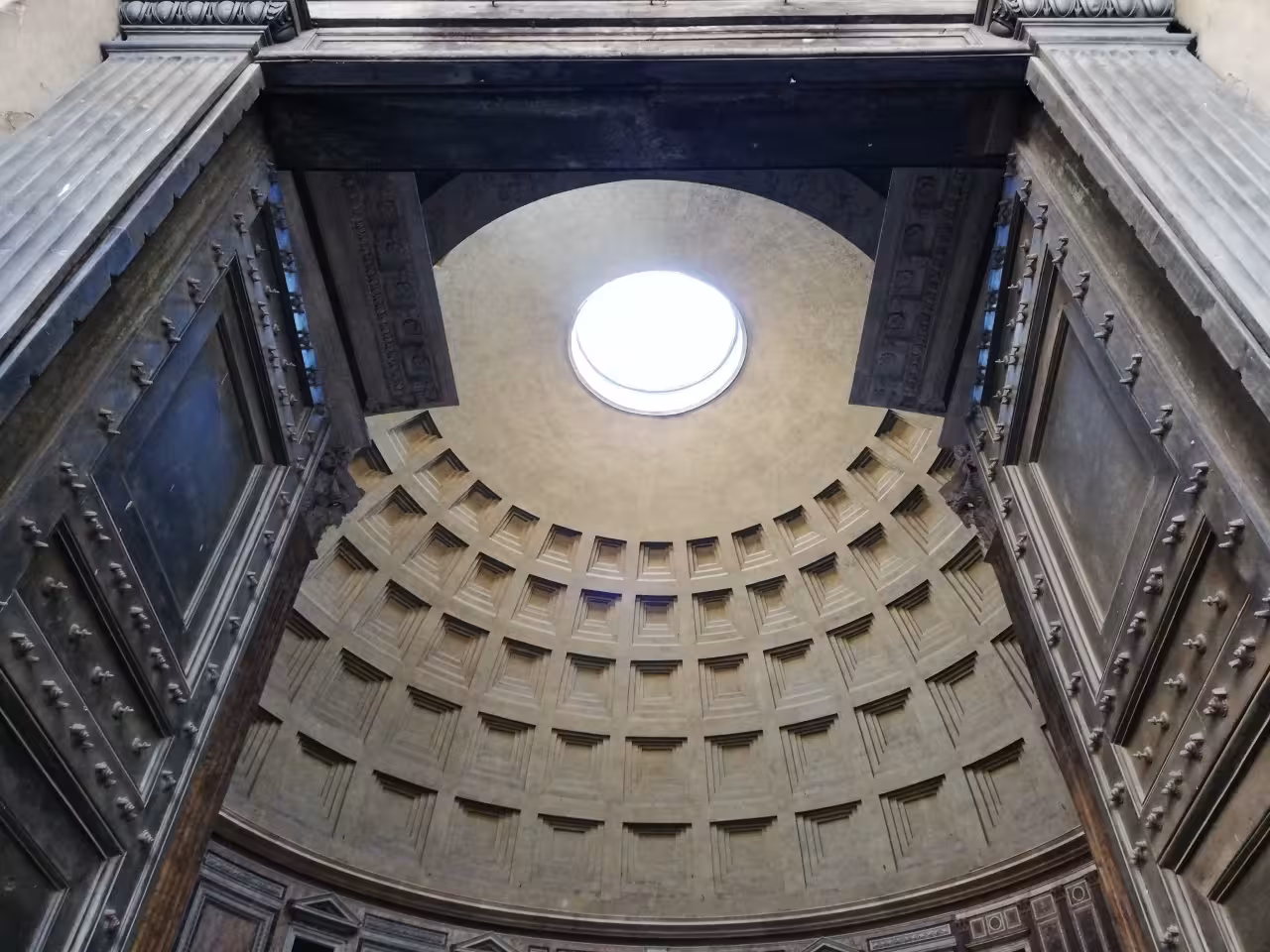 Inside the Pantheon, Rome, looking up at the coffered dome and oculus on Truly Rome guided tour