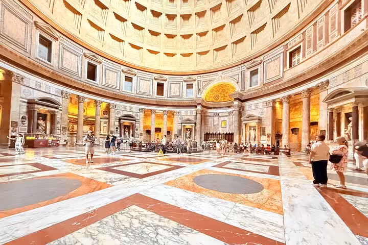 Expansive view of the Pantheon's grand interior, showcasing its iconic dome and architectural elegance in Rome.