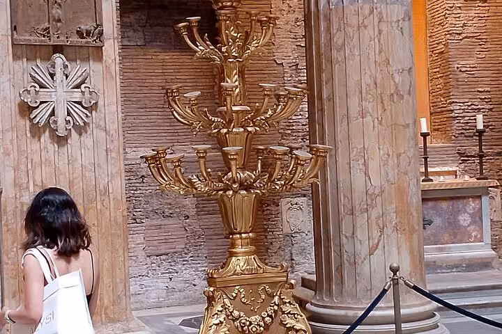 Interior of the Pantheon featuring ornate golden candelabra and ancient Roman architecture, ideal for history enthusiasts.