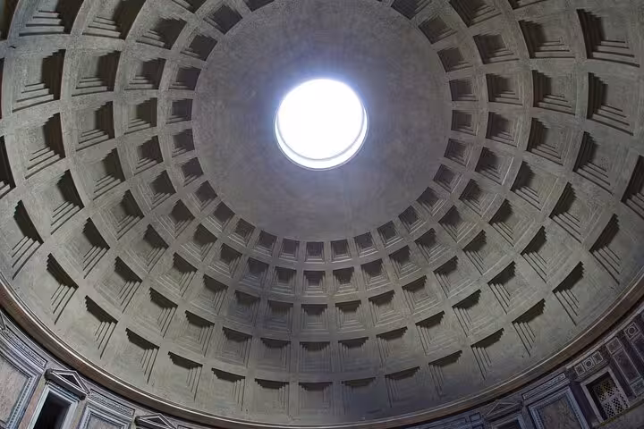 View of the Pantheon's iconic oculus and intricate dome, highlighting its architectural marvel in Rome.
