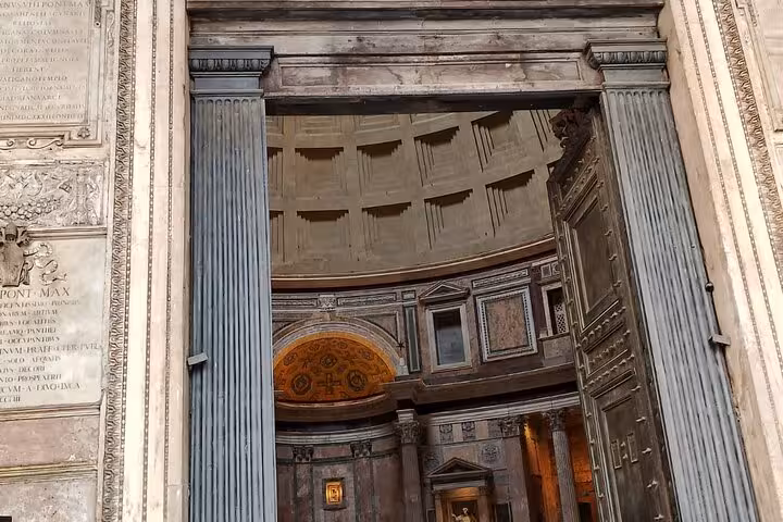 Step inside the Pantheon in Rome, showcasing its majestic interior architecture and intricate dome details with an audio guide experience.