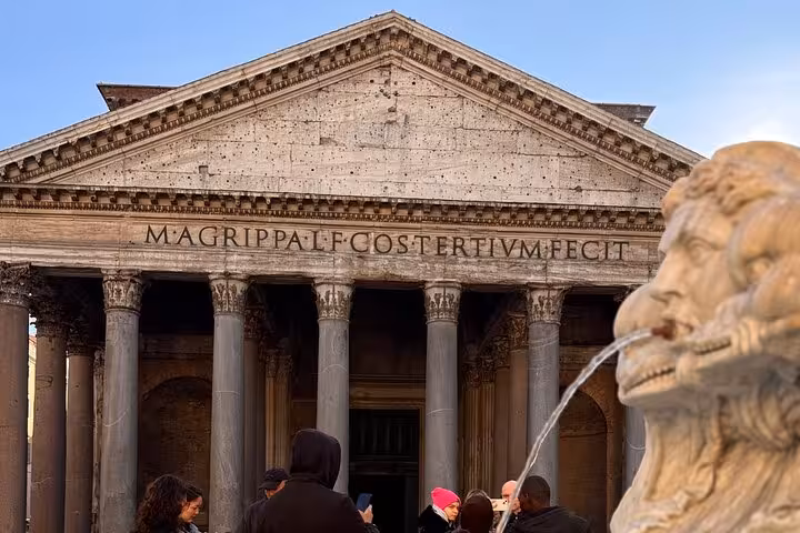 Front view of the Pantheon with fountain sculpture, showcasing Rome's ancient architectural grandeur.