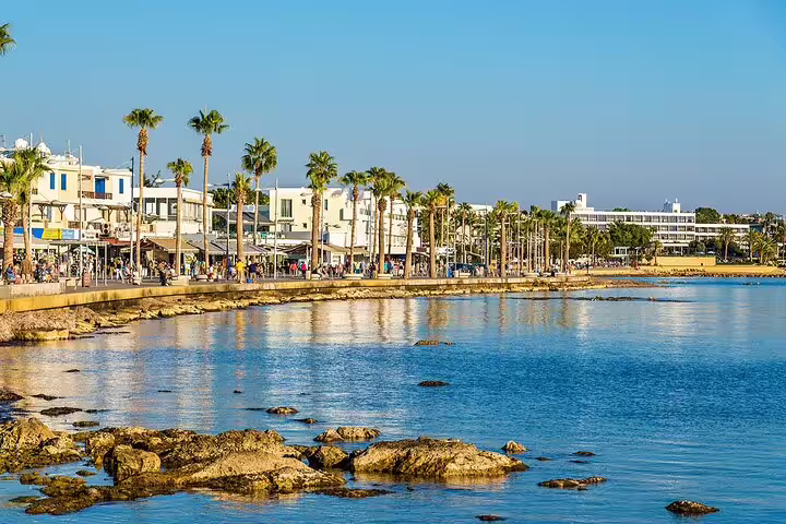 Palm-lined Paphos seafront promenade and harbor views, scenic stop on a Western Cyprus sightseeing tour