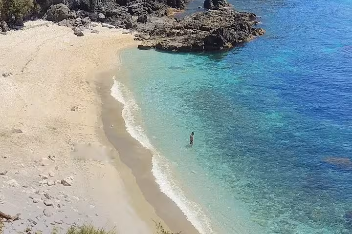 Idyllic paradise beach with golden sands and clear blue waters, ideal for relaxation and swimming near Malaga.