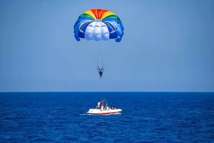 Colorful parasailing over the Red Sea in Sharm El Sheikh with speedboat tow, private transfer included