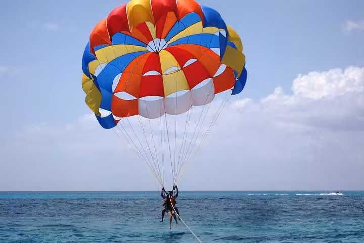 Colorful parasailing over the Red Sea in Sharm El Sheikh with private transfer and ocean views