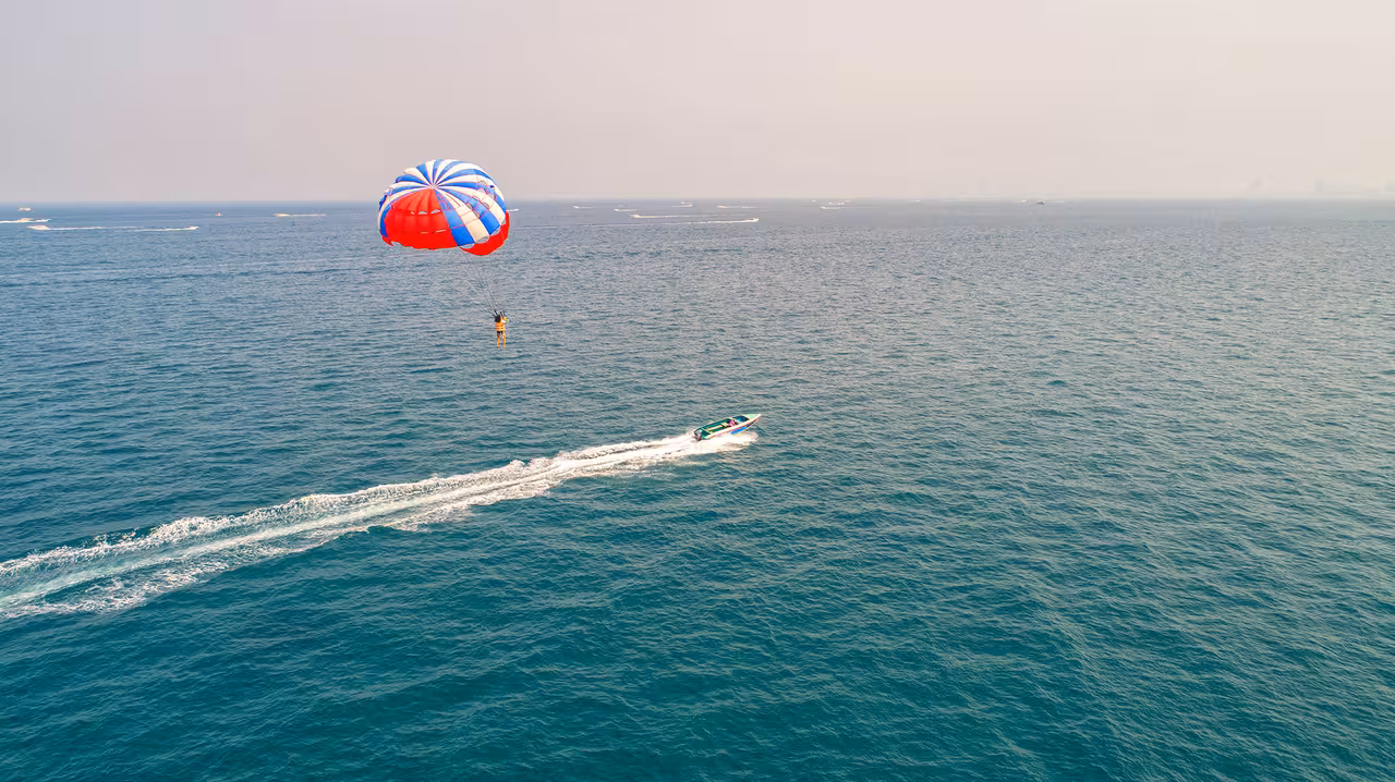 Experience thrilling parasailing over the stunning ocean waters of Santa Cruz de Tenerife with breathtaking views.