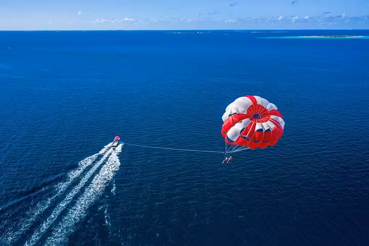 Aerial view of parasailing in Sharm El Sheikh, Red Sea as boat tows canopy, hotel pickup private transfer