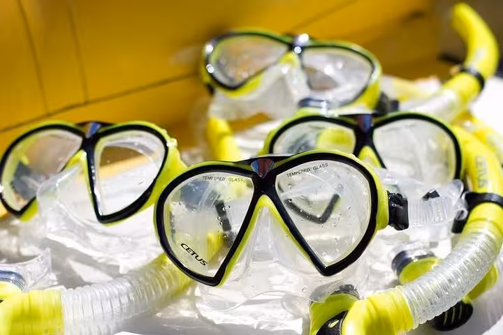 Diving masks and snorkels ready for exploration on a Paraty boat tour with lunch, perfect for adventure seekers.