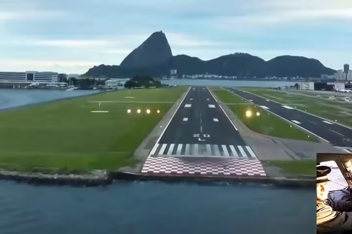Scenic view of Rio de Janeiro's airport runway with iconic Sugarloaf Mountain in the background, ideal for travelers.