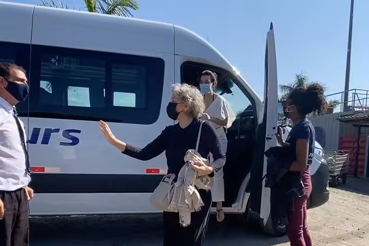 Passengers boarding a clean and safe shuttle van for a shared journey from Paraty to São Paulo, highlighting ease and comfort.